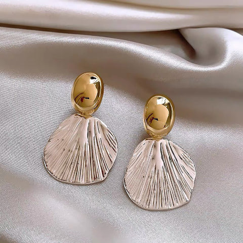 Aretes Coraza